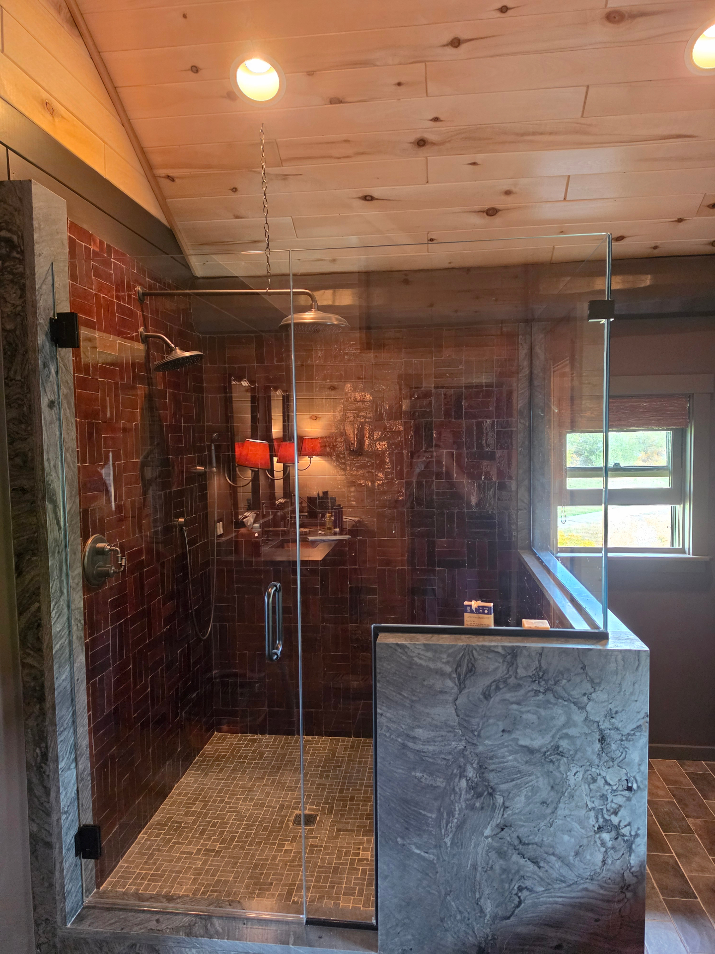 Frameless shower with rain-style showerhead at an Airbnb in Paonia, Colorado